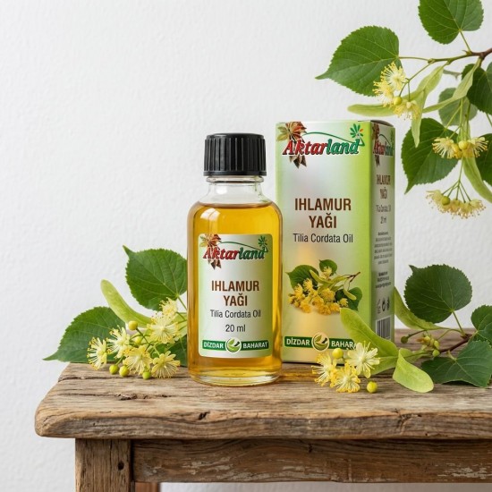 "Ihlamur yağı şişesi ve ihlamur çiçekleri doğal aromaterapi uygulaması"